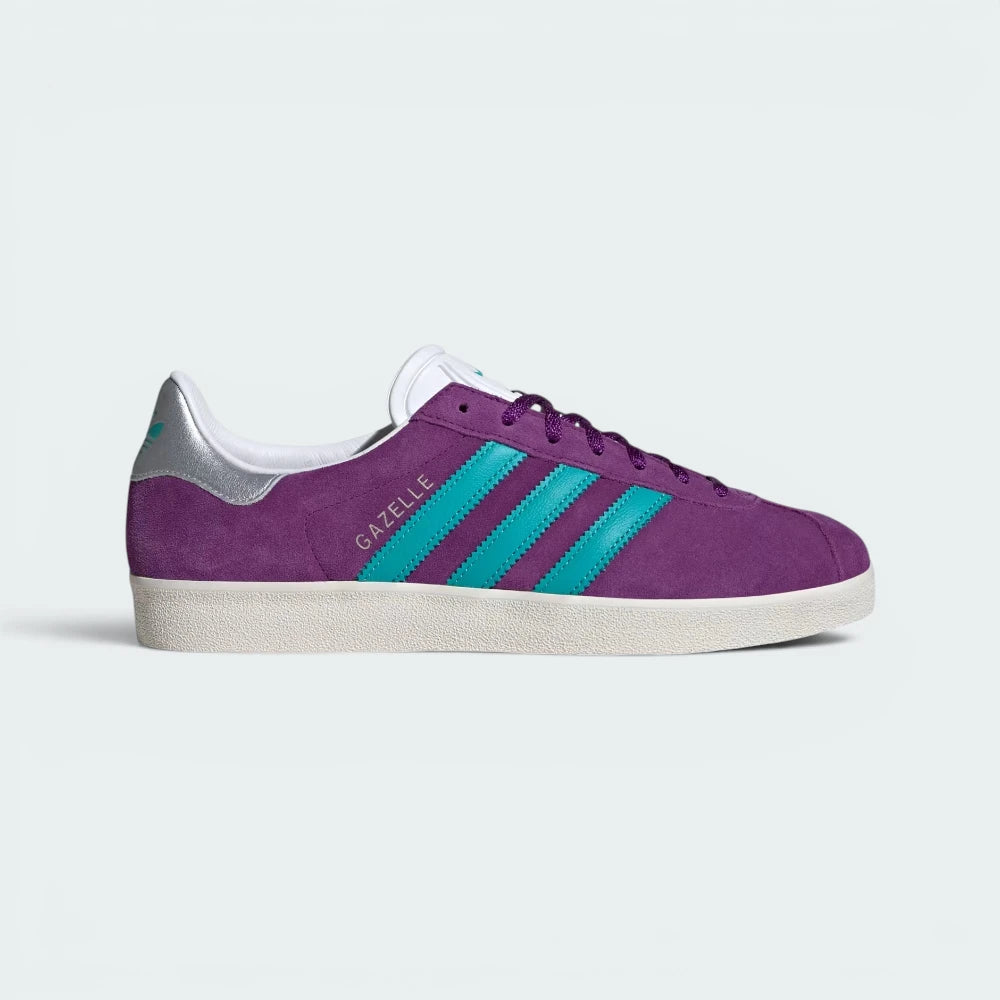Highlights the high-velocity sweep of the Hi-Res Aqua serrated 3-Stripes and the professional, velvety depth of the Glory Purple nubuck panels leading back to the flashing silver heel tab.