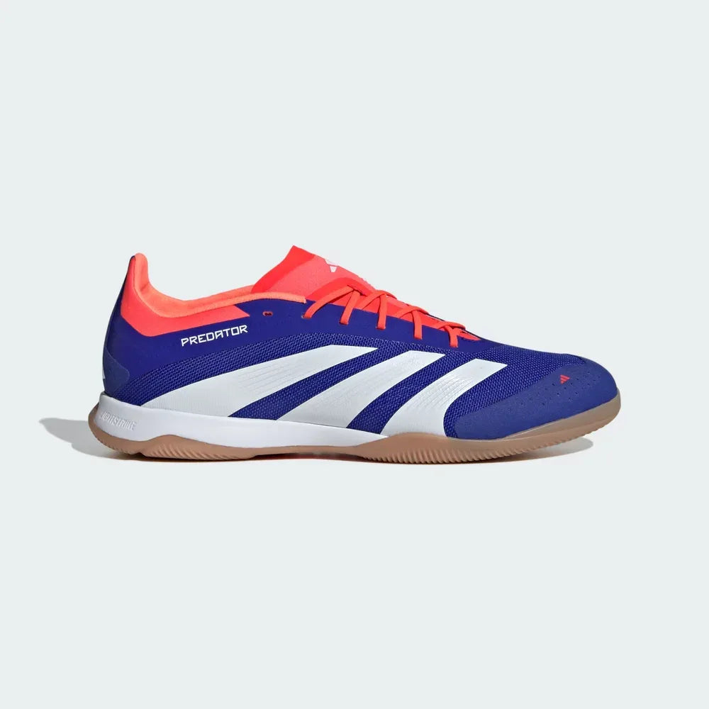 Side profile of the Adidas Predator Elite Indoor boots in Lucid Blue, showing the Solar Red 3-Stripes, the mesh upper construction, and the low-profile Lightstrike midsole.