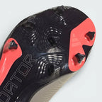 Detailed zoom on the edge of the Controlplate 2.0, showcasing the metallic finish and the durable construction of the firm ground studs.