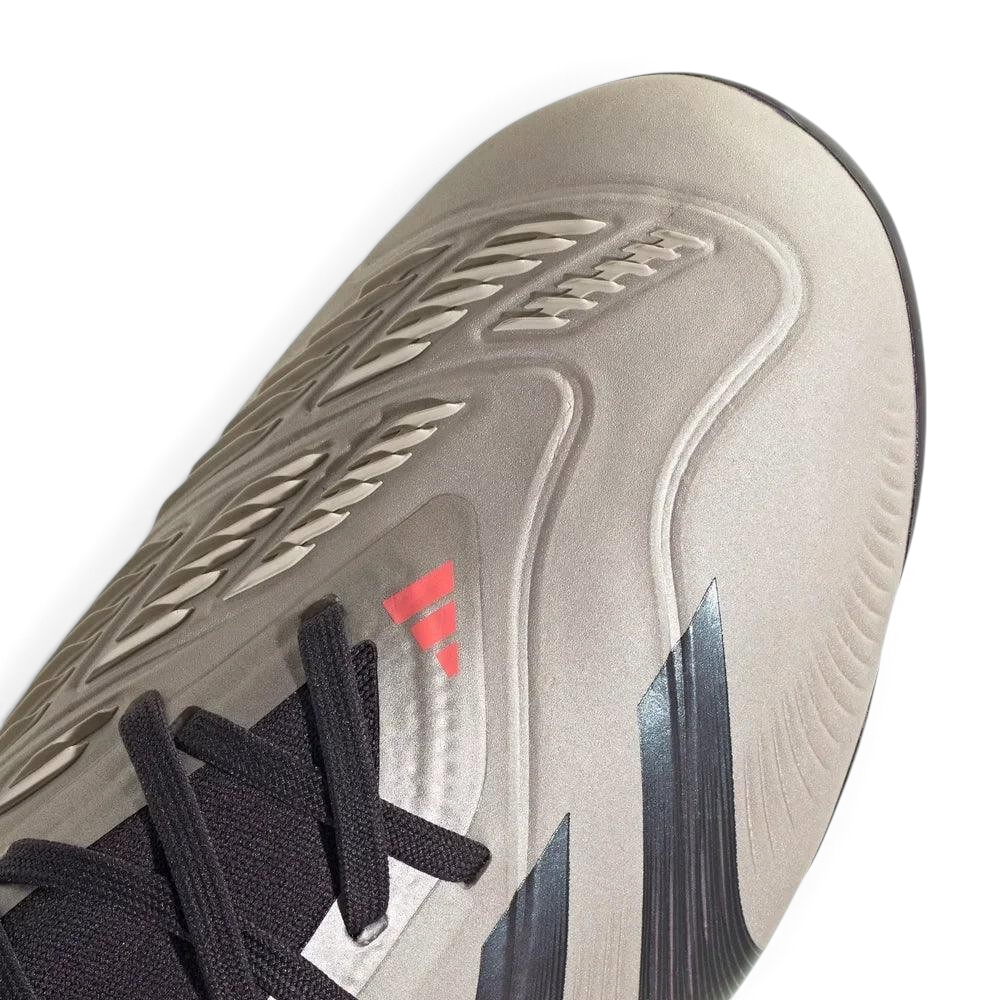 Close-up of the front, showing the detailed rubber Strikeskin elements and the precision lacing system for a secure lockdown.