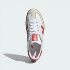 Top-down view of the trainers, showcasing the white lacing system and the premium grey nubuck T-toe overlay.