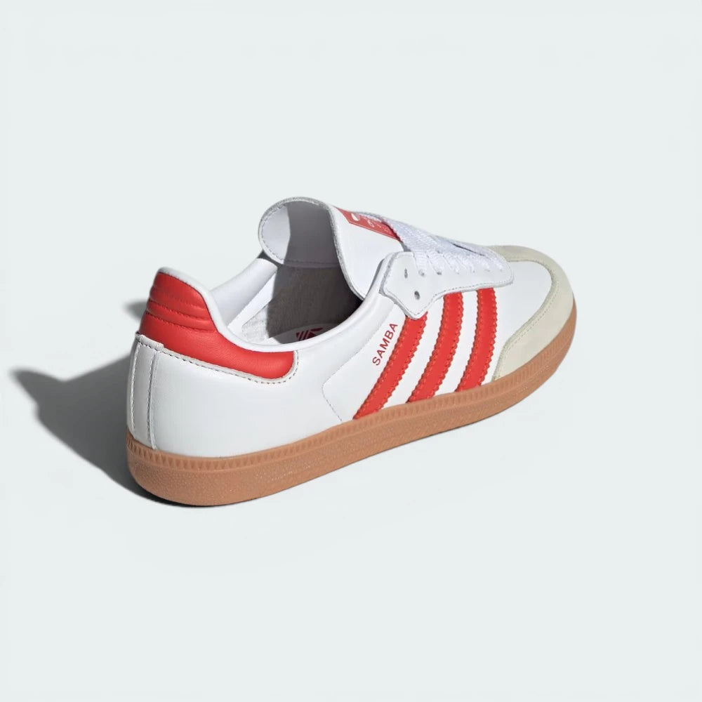Rear view of the shoes, focusing on the Solar Red heel tab and the low-cut athletic collar.
