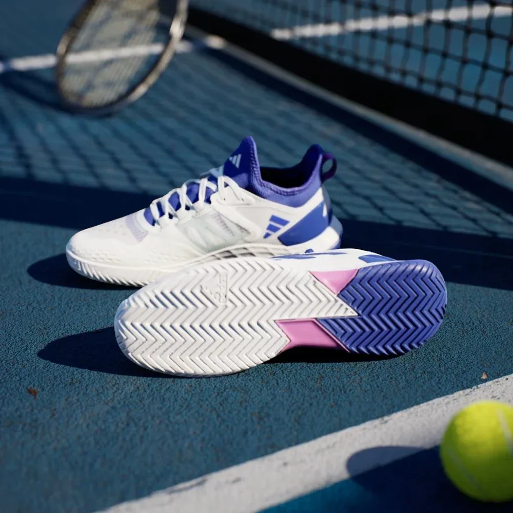 View of the Adiwear hard-court outsole, showcasing the specialized herringbone-style traction pattern for maximum grip.