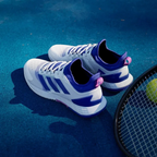 Top-down view of the tennis shoes, highlighting the breathable white mesh, integrated lacing system, and the sock-like collar.