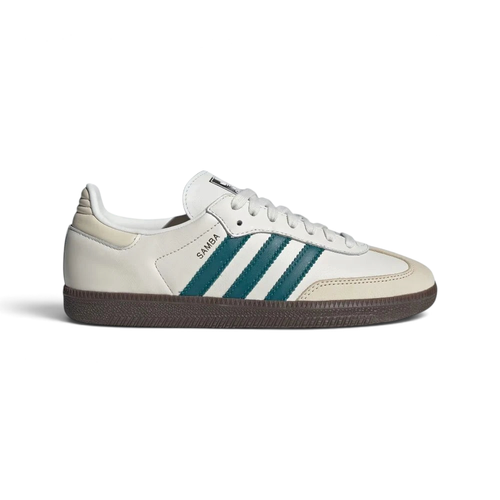 Highlights the high-velocity sweep of the Legacy Teal serrated 3-Stripes, the professional gold-foil Samba lettering, and the striking visual depth of the Cloud White leather upper. Main image
