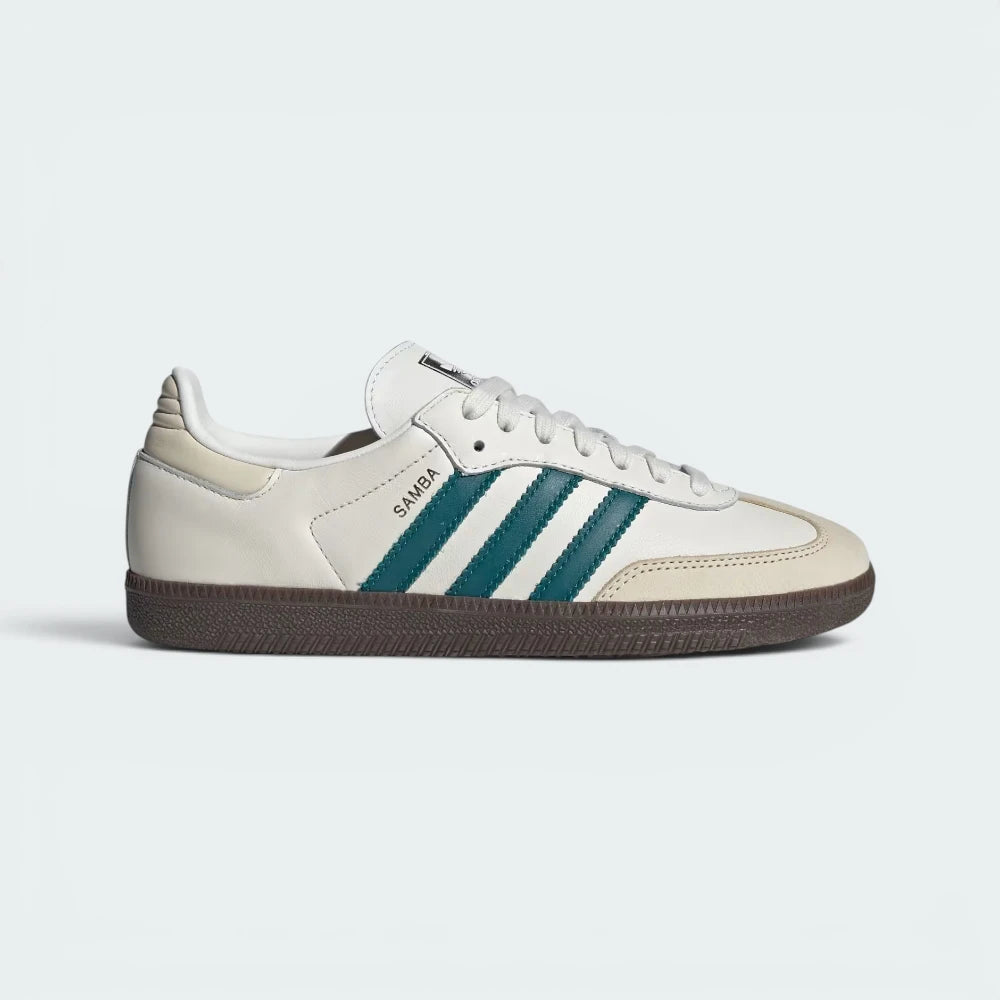 Highlights the high-velocity sweep of the Legacy Teal serrated 3-Stripes, the professional gold-foil Samba lettering, and the striking visual depth of the Cloud White leather upper. Main image