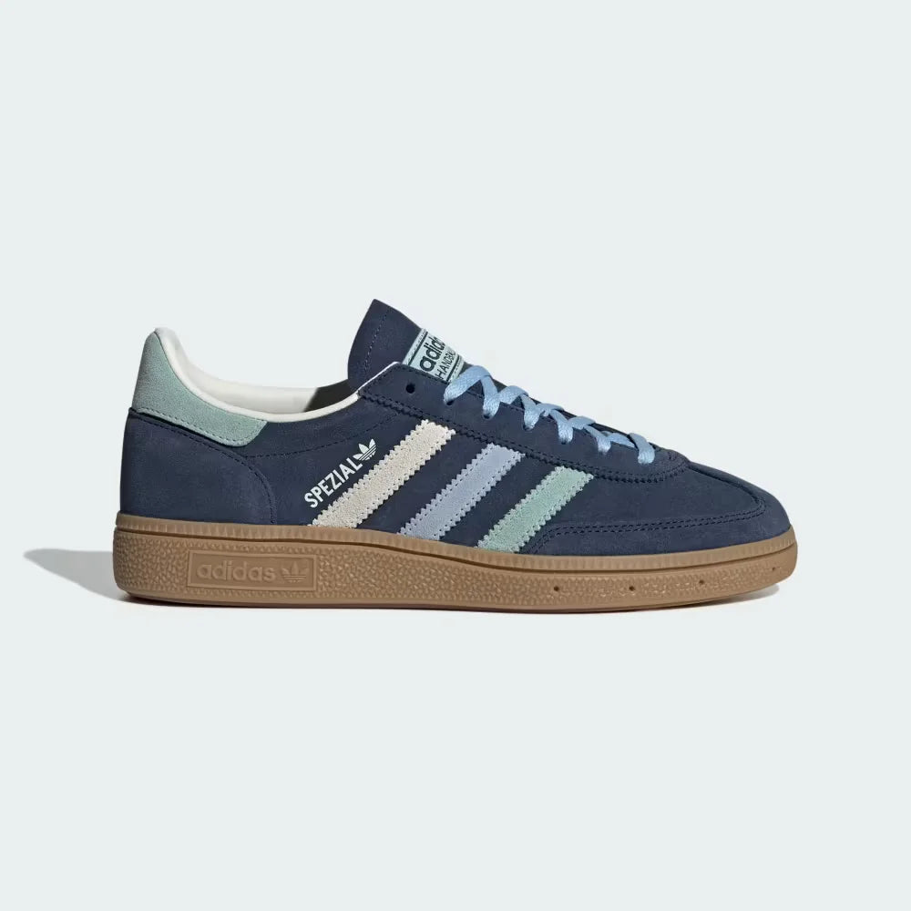 Side Profile Image: The Night Indigo Spezial, highlighting the Hazy Green Three-Stripes and the classic low-profile gum rubber sole.