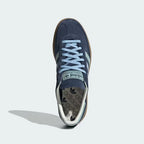 Top-Down View of Pair: Looking down at the suede lacing system and the Clear Sky blue tongue branding.