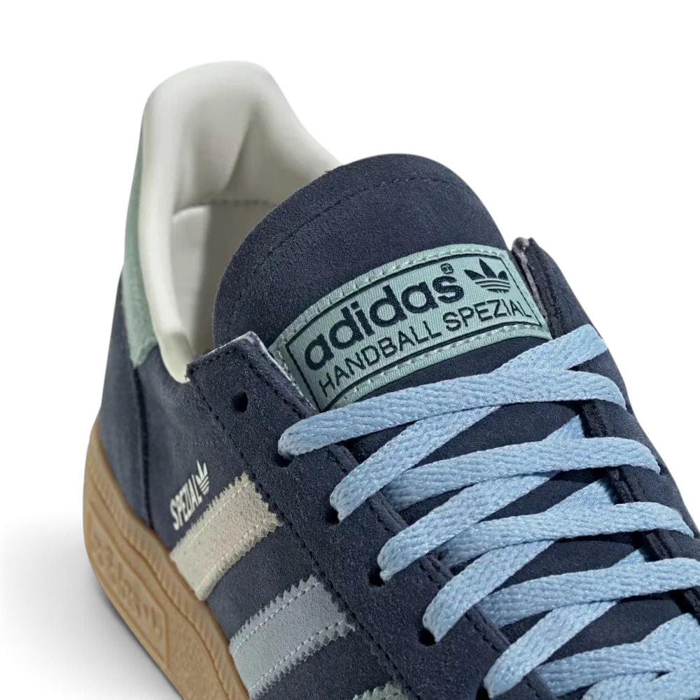 Zoom Looking at the Front of the Shoes and Laces: A close-up of the fine suede grain and the precision stitching around the toe box.