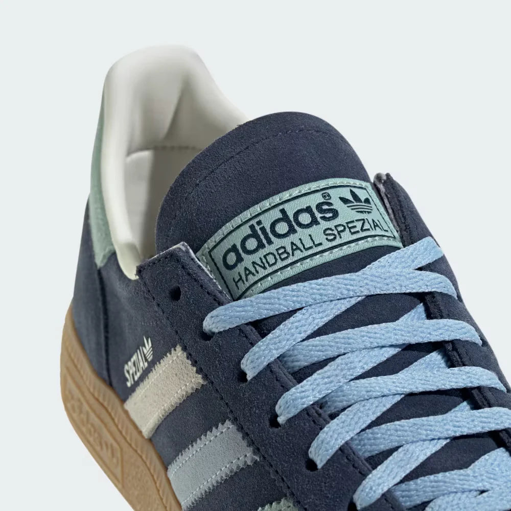 Zoom Looking at the Front of the Shoes and Laces: A close-up of the fine suede grain and the precision stitching around the toe box.