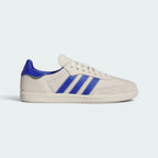 Highlights the high-velocity sweep of the zigzag-stitched 3-Stripes and the professional, minimalist depth of the Alumina coated ECCO leather and the unique floating heel tab.