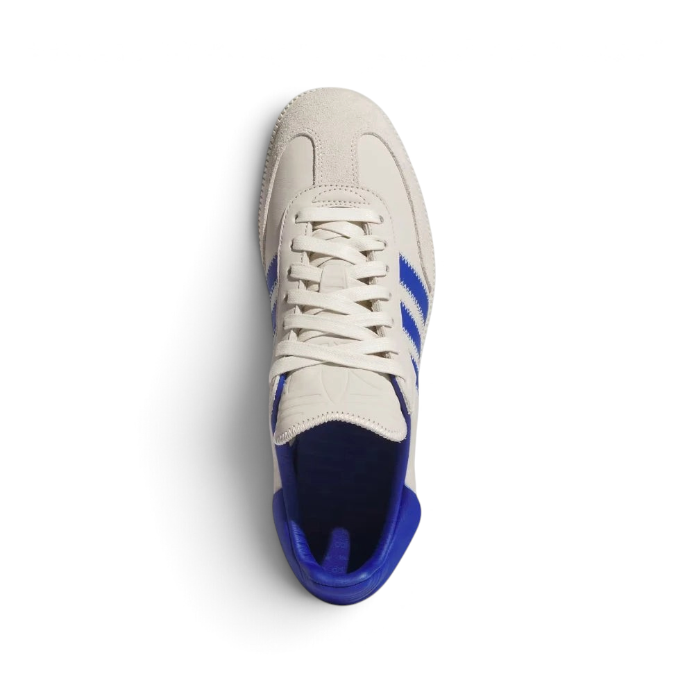 Focuses on the locked-in lace closure, the clean alignment of the elongated tongue decorated with accent stitching, and the premium texturing of the suede T-toe box overlay.