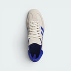 Focuses on the locked-in lace closure, the clean alignment of the elongated tongue decorated with accent stitching, and the premium texturing of the suede T-toe box overlay.