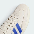 Details the intricate artisan zigzag stitching lines tracing the premium suede toe guard and the precision lace configuration.