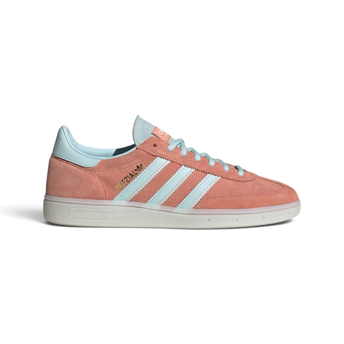 Side Profile Image: Studio lateral shot of the adidas Handball Spezial in Wonder Clay and Almost Blue, highlighting the dusty pink synthetic upper, pale blue serrated three stripes, gold foil SPEZIAL lettering, and a translucent rubber outsole.    Main image