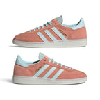 A pair of Adidas Gazelle sneakers in a dusty coral pink colorway with light blue accents on the laces, collar lining, and heel tab, and white soles. The shoes are shown from both side and front-three-quarter angles against a clean white background.