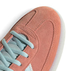 Zoom Looking at the Front of the Shoes and Laces: Macro focus on the perforated toe box detailing, synthetic mudguard overlay, and pastel blue flat laces.   