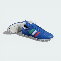 View of the classic white Firm Ground (FG) outsole, showcasing the iconic 12-stud configuration for optimal stability.