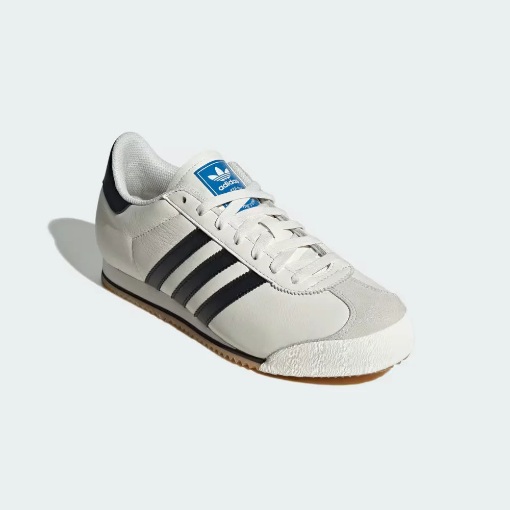 Emphasising the T-toe stitching and the contrast between the white leather and black accents.