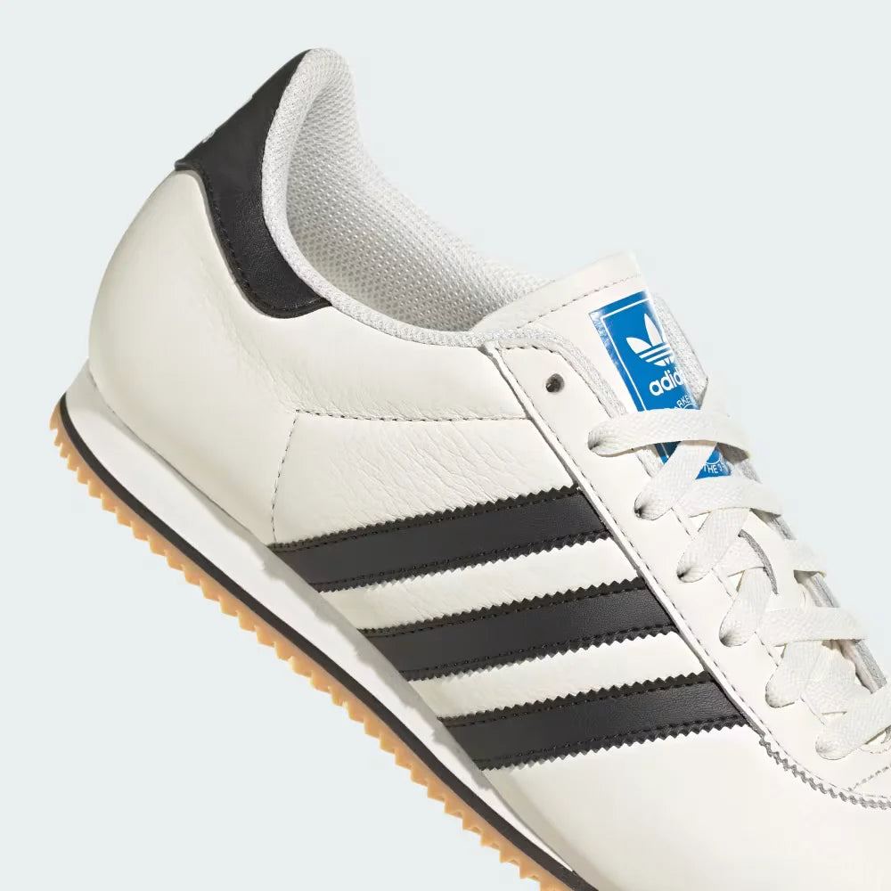 A close-up of the smooth leather grain and the precision stitching around the heel