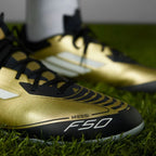 Close-up of the forefoot area, showing the textured HybridTouch material for ball control and the secure lace closure.