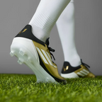 Rear view focusing on the structured heel cup and the signature Messi logo detail in Core Black.
