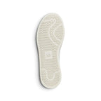 Outsole View: Bottom profile of the shoe displaying the off-white rubber cupsole featuring circular pivot dots and embossed adidas Trefoil branding at the heel.