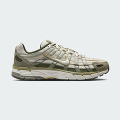 Nike P-6000 men's trainers in green abyss with black and volt accents, side profile showing layered mesh and synthetic/leather overlays.