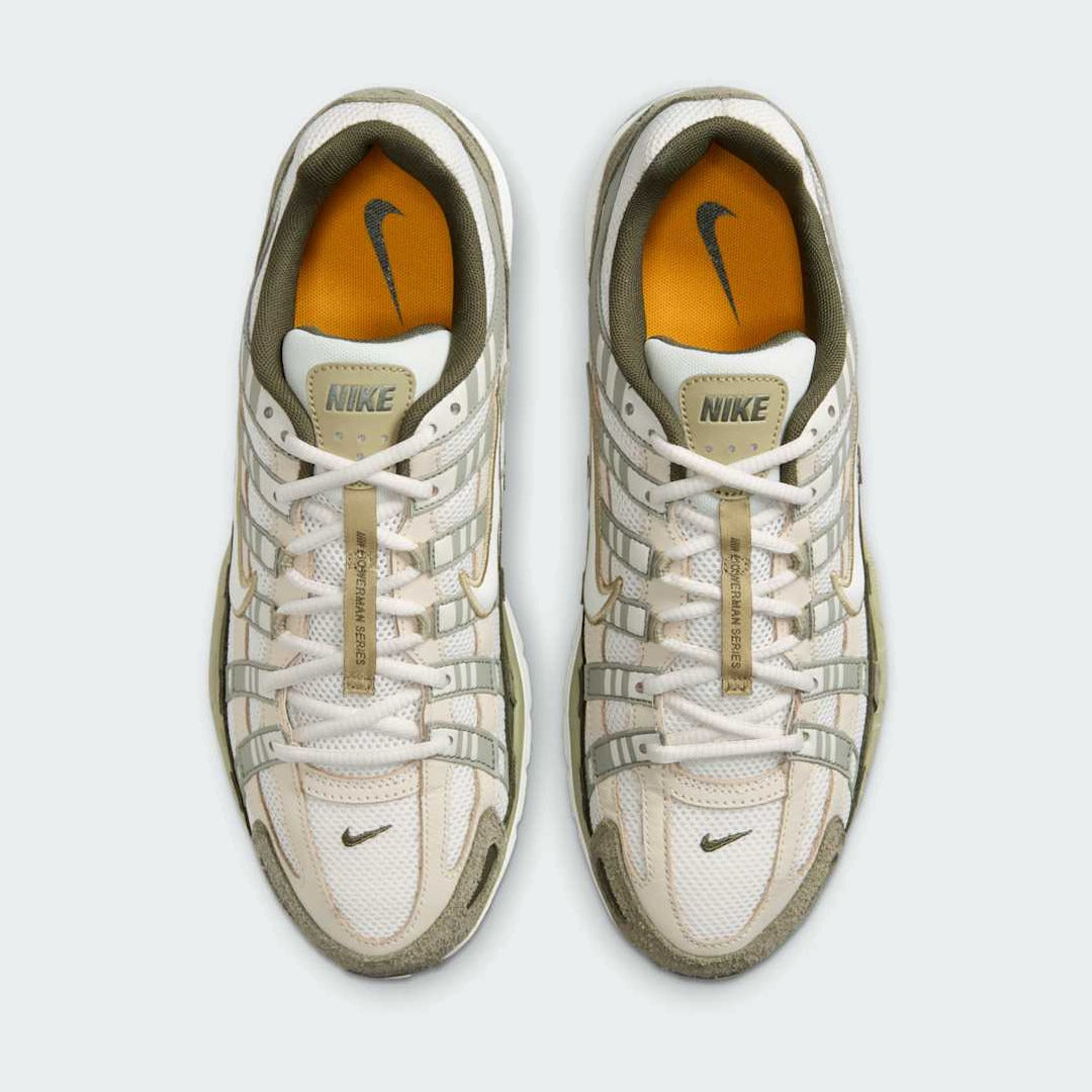 Top-down view of a pair of Nike P-6000 men's trainers in green, highlighting the intricate layered upper and lace-up closure.