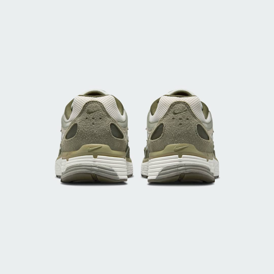 Rear view of the Nike P-6000 men's trainers, focusing on the heel design, layered materials, and subtle branding.