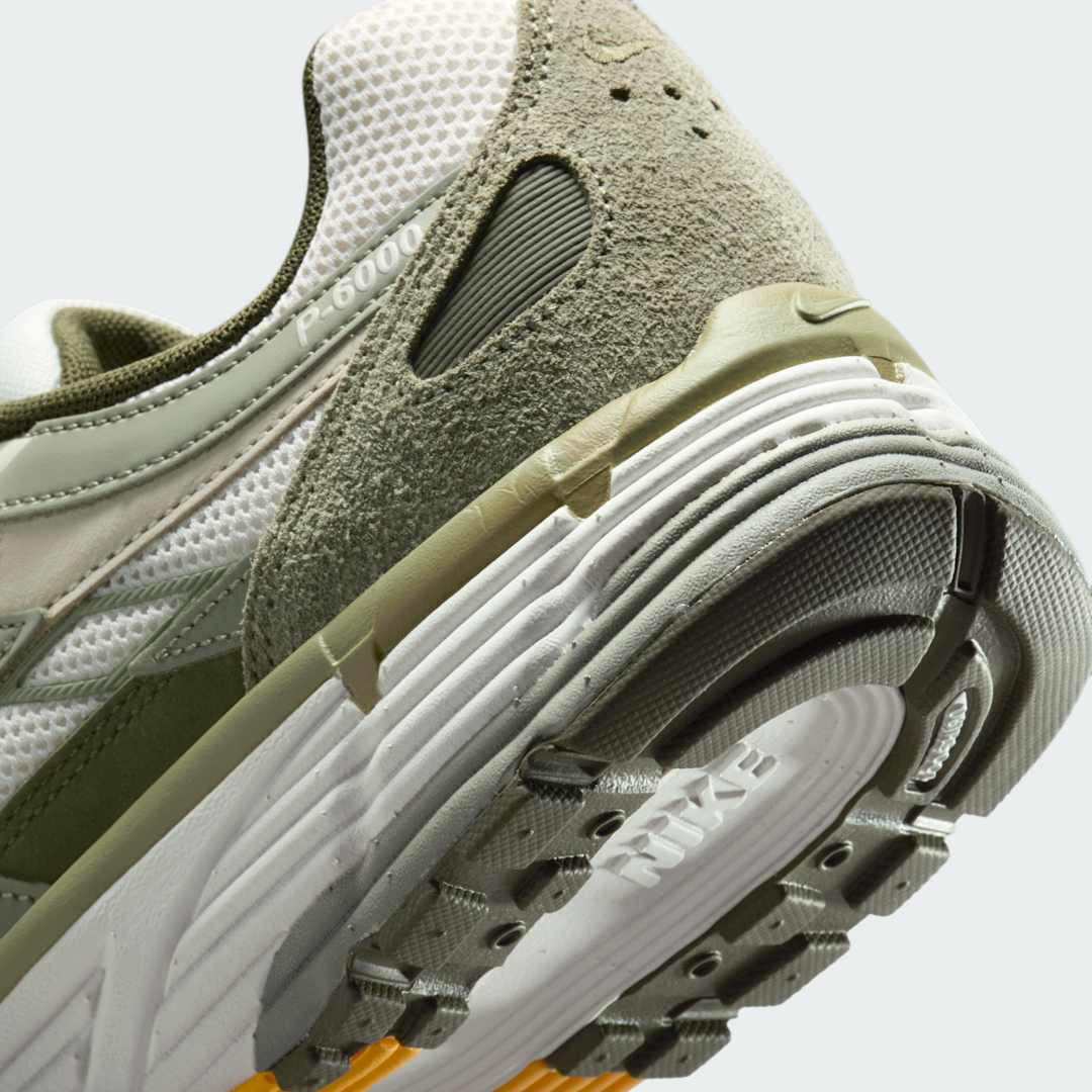 Detailed zoom on the outsole and midsole of the Nike P-6000 men's trainers, highlighting the cushioned foam and durable rubber outsole for comfortable wear.