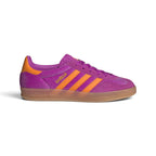 Side Profile Image: Studio lateral shot of the adidas Gazelle Indoor in Purple Burst and Eqt Orange, highlighting the rich purple velvet upper, contrasting orange serrated three stripes, gold foil Gazelle lettering, and translucent gum rubber midsole and outsole.   