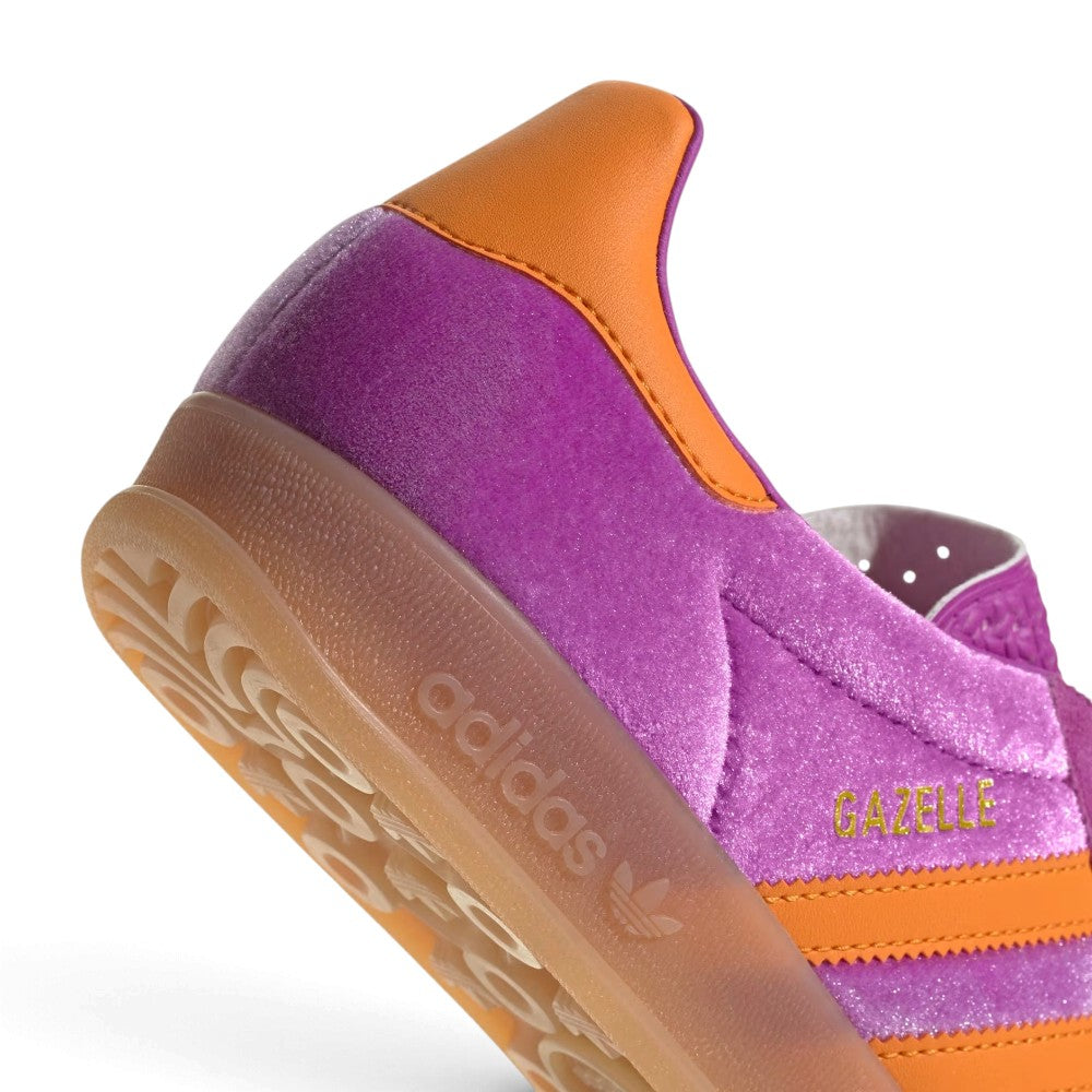 Zoom Looking at the Outsole and Midsole: Detailed close-up angle capturing the embossed adidas branding on the translucent gum rubber midsole sidewall and the traction tread wrap.   