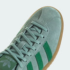 A close-up of the fine suede grain and the precision stitching around the toe box.