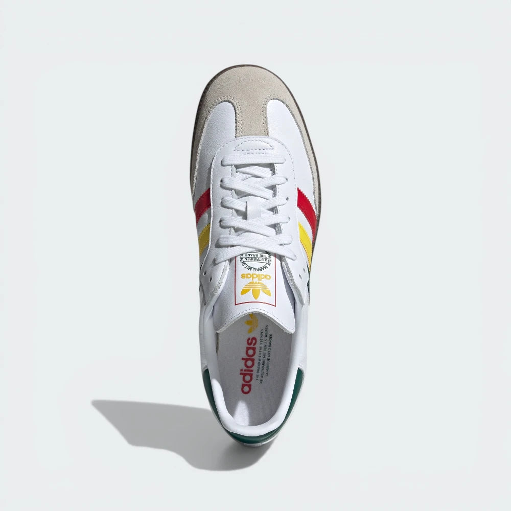 White Adidas sneaker with colorful accents on a light gray background