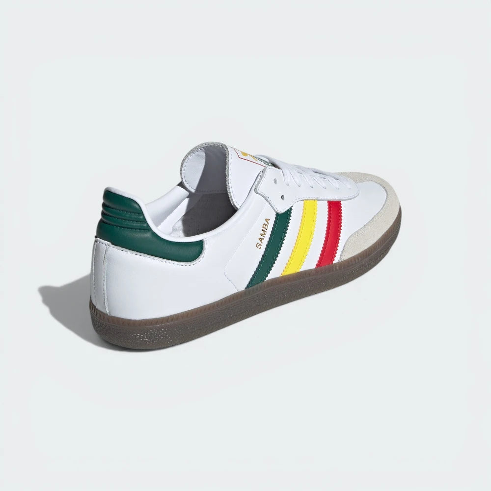 White sneaker with colorful stripes on a light gray background