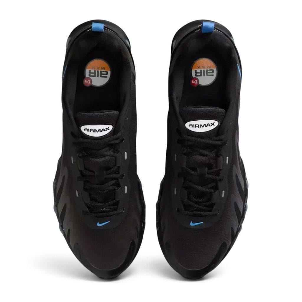 Top-down view of a pair of Nike Air Max DN Men's running shoes in black, highlighting their futuristic design and lace-up closure.