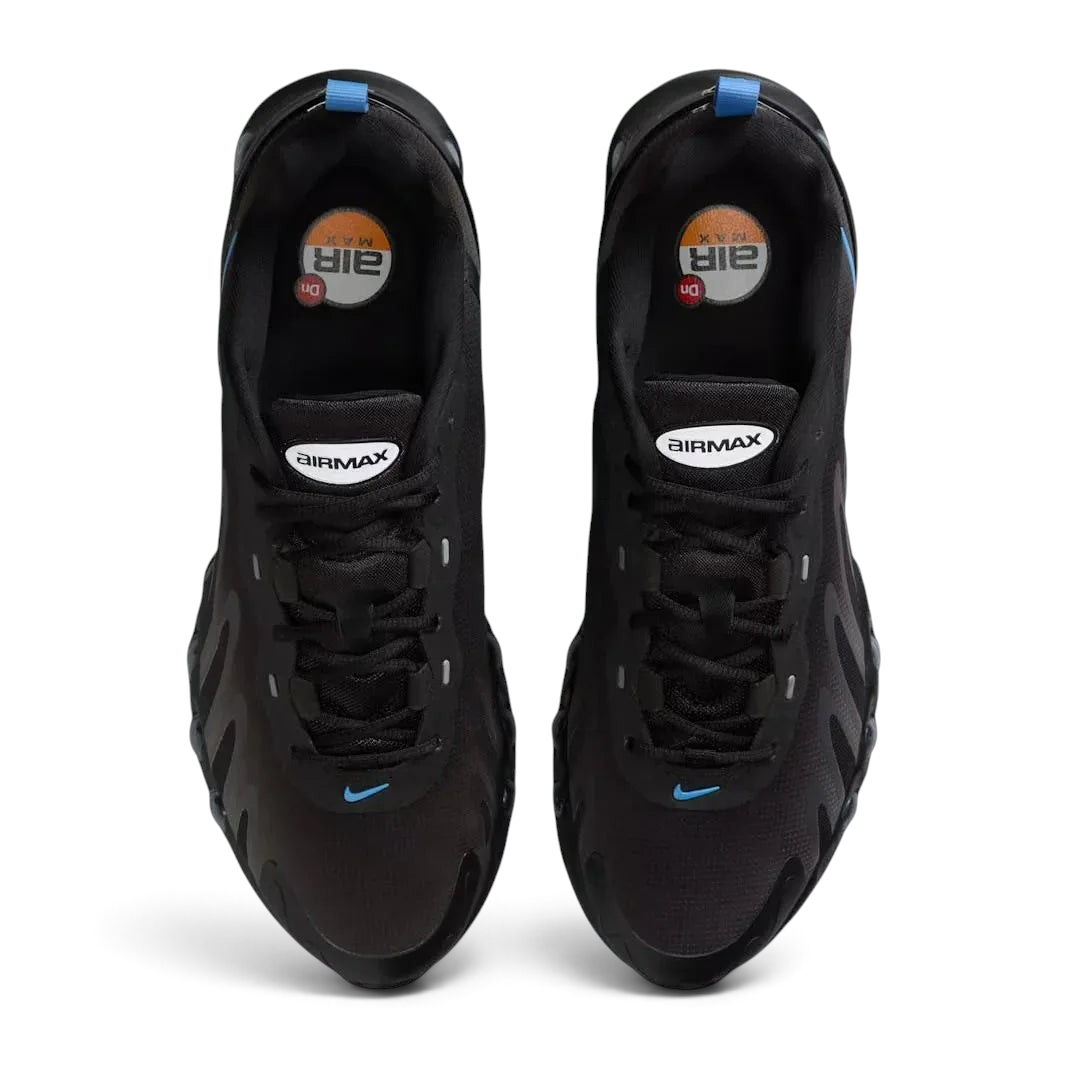 Top-down view of a pair of Nike Air Max DN Men's running shoes in black, highlighting their futuristic design and lace-up closure.