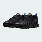 Angled view of two Nike Air Max DN Men's black running shoes, side by side, showcasing their bold, modern design and prominent Air unit.