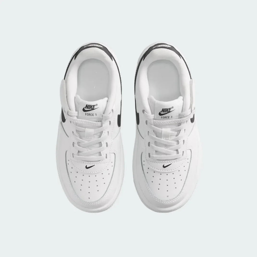 Top-down view of a pair of Nike Air Force 1 Low EasyOn Kids' trainers in white, highlighting the wide opening mechanism and iconic silhouette.