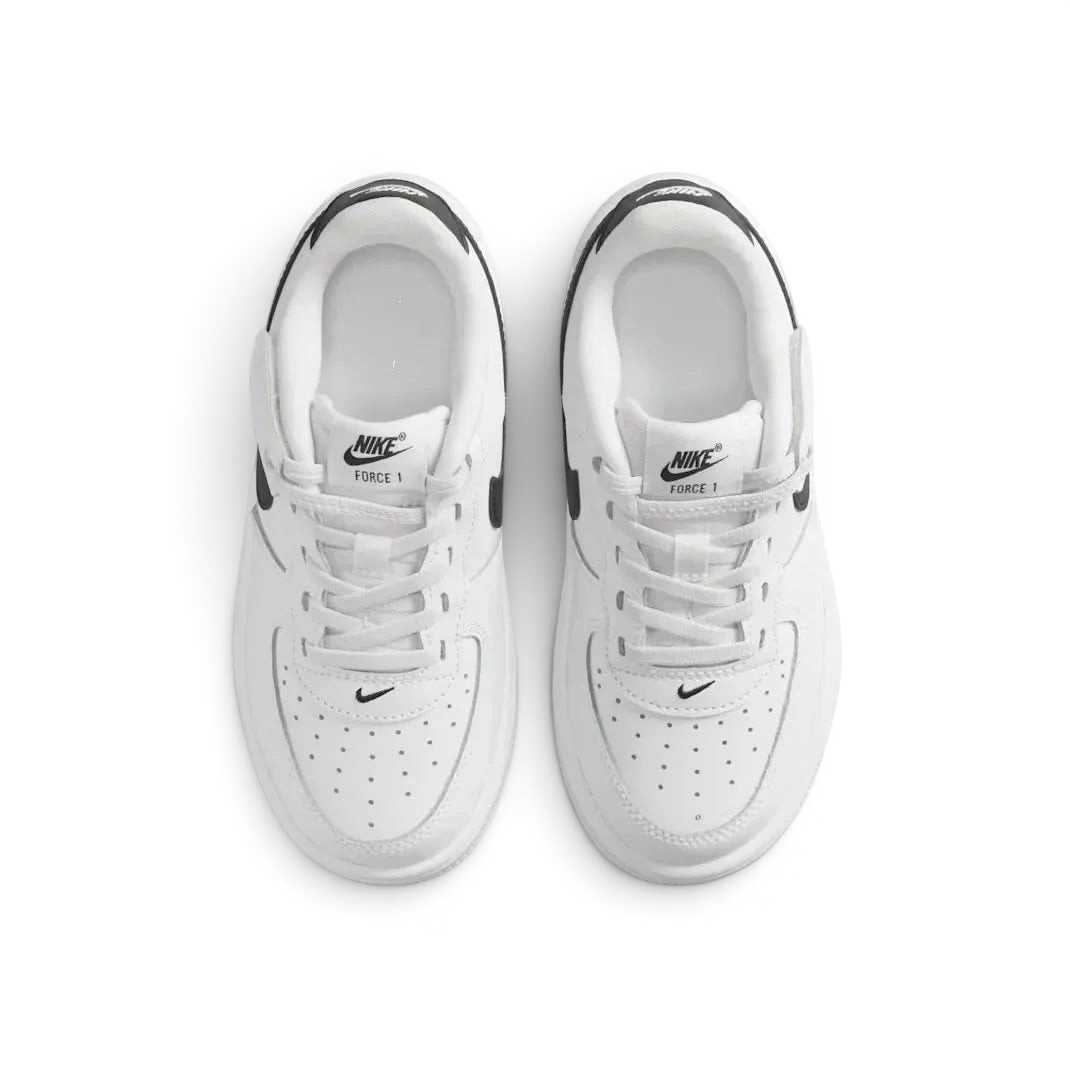 Top-down view of a pair of Nike Air Force 1 Low EasyOn Kids' trainers in white, highlighting the wide opening mechanism and iconic silhouette.