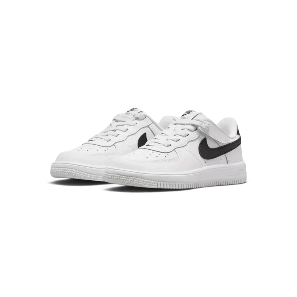Angled view of two Nike Air Force 1 Low EasyOn Kids' trainers in white and black, side by side, showcasing their timeless design and clean aesthetic.