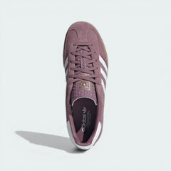 Top-down view of the trainers, showcasing the white lace closure and the iconic T-toe suede construction.