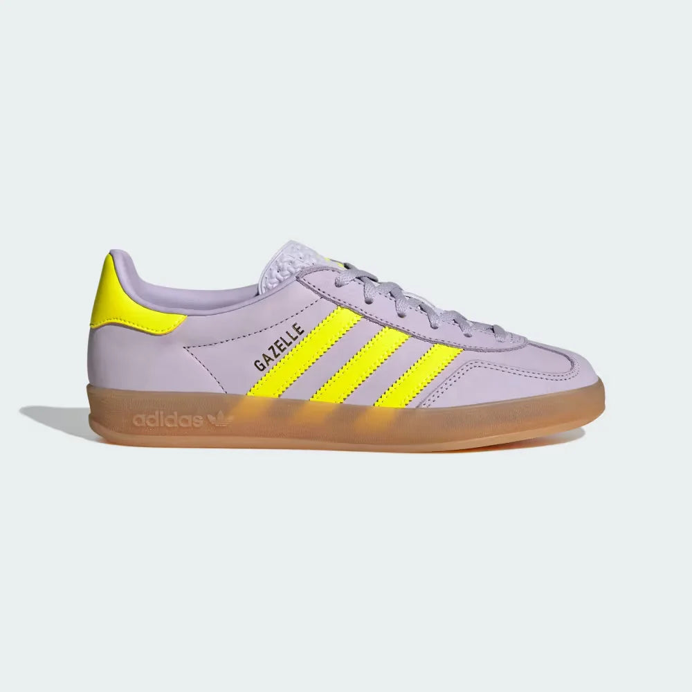 Side Profile Image: The Silver Dawn nubuck Gazelle, highlighting the electric Solar Yellow 3-Stripes and the translucent gum rubber sole.