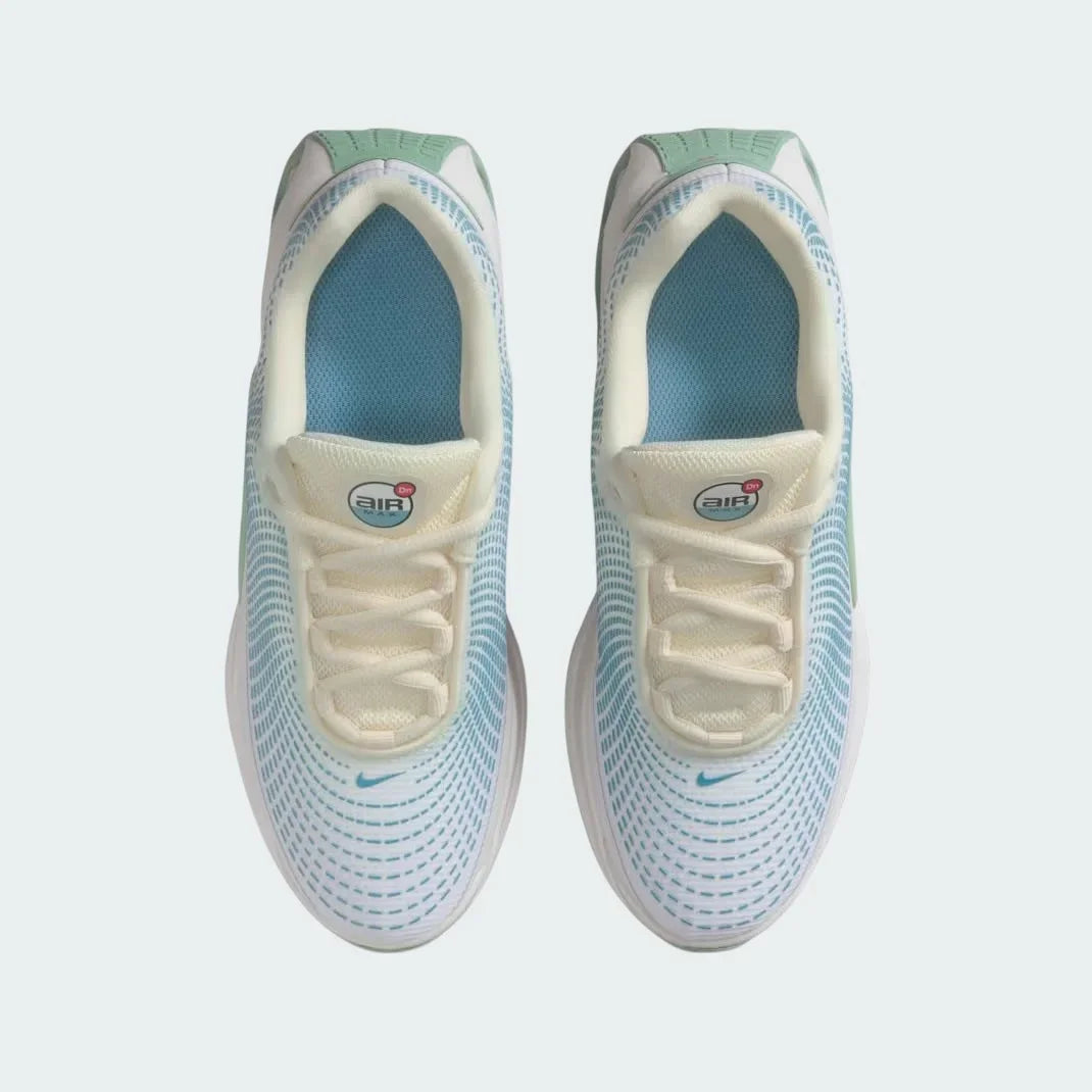 Top-down view of a pair of Nike Air Max DN Juniors' running trainers in light green, highlighting their futuristic design and lace-up closure.