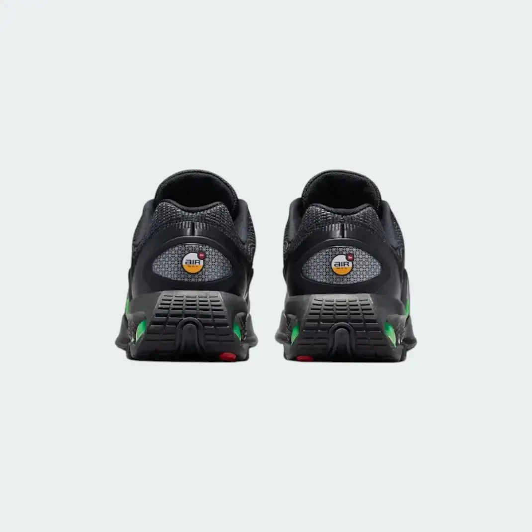 Rear view of the Nike Air Max DN Juniors' black running trainers, focusing on the visible Dynamic Air unit in the heel and molded heel counter.