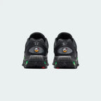 Rear view of the Nike Air Max DN Juniors' black running trainers, focusing on the visible Dynamic Air unit in the heel and molded heel counter.