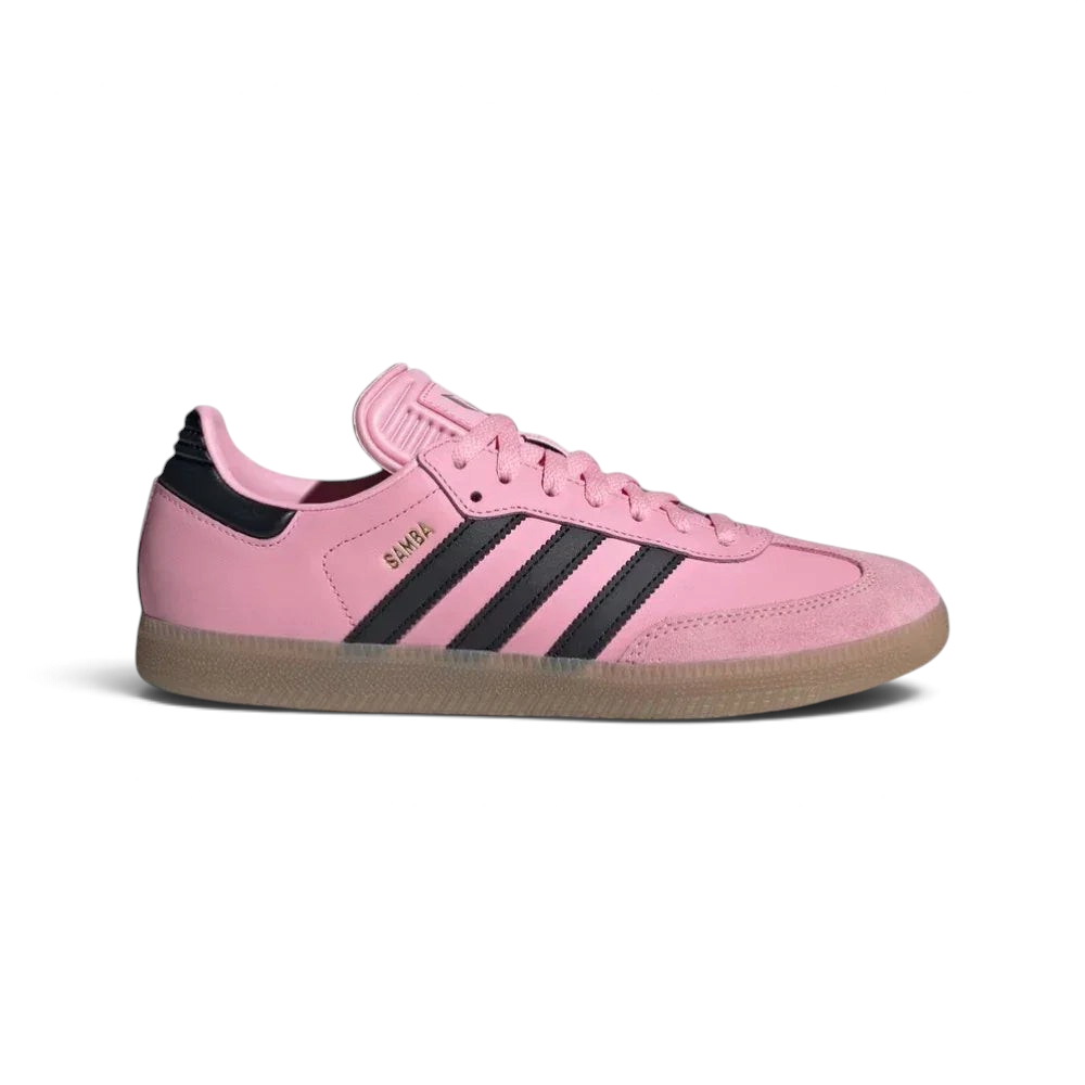Side profile of the Pink adidas Samba Messi, showing the black serrated 3-Stripes and the classic low-top indoor silhouette. Main image