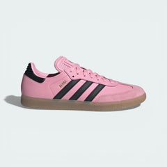 Side profile of the Pink adidas Samba Messi, showing the black serrated 3-Stripes and the classic low-top indoor silhouette.