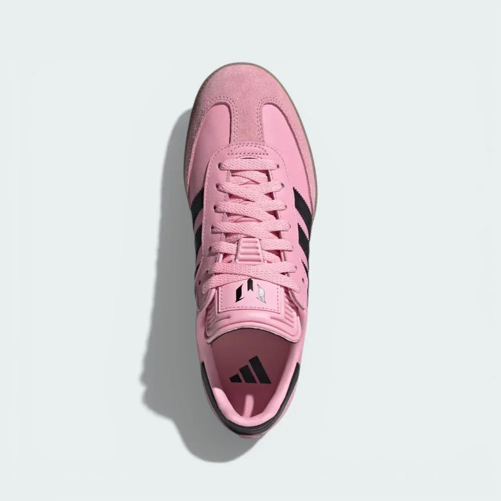 Top-down view of the Inter Miami edition boots, highlighting the pink leather upper, suede T-toe, and the Messi logo on the tongue.